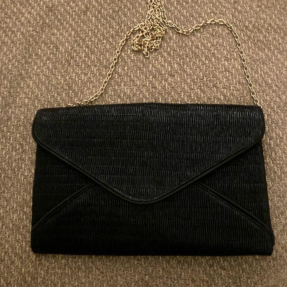 Black clutch with gold chain